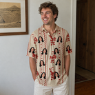 Real-life photo of someone wearing Men's Jolly Jingle Custom Face Polo Shirt — custom faces printed all-over