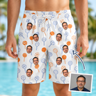 Man wearing Men's Taffy Twirl Custom Face Beach Shorts — custom faces printed all-over