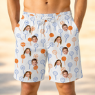 Model wearing Men's Taffy Twirl Custom Face Beach Shorts printed with kids' faces