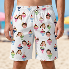 Model wearing Men's Wishful Scoops Custom Face Beach Shorts printed with kids' faces