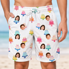 Model wearing Men's Cake Craze Custom Face Beach Shorts printed with kids' faces