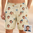 Man wearing Men's Sugar Spin Custom Face Beach Shorts — custom faces printed all-over