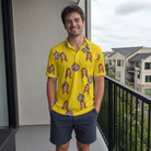 Real-life photo of someone wearing Men's Mirrorball Mischief Custom Face Polo Shirt — custom faces printed all-over