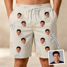 Man wearing Men's Toast Tiaras Custom Face Beach Shorts — custom faces printed all-over
