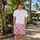 Real-life photo of someone wearing Men's Last Toast Custom Face Beach Shorts — custom faces printed all-over