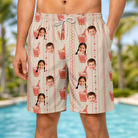 Model wearing Men's Bubbly Buckets Custom Face Beach Shorts printed with kids' faces