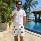 Real-life photo of someone wearing Men's Dune Dynasty Custom Face Beach Shorts — custom faces printed all-over