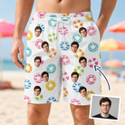 Man wearing Men's Rainbow Ripples Custom Face Beach Shorts — custom faces printed all-over