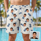 Man wearing Men's Golden Getaway Custom Face Beach Shorts — custom faces printed all-over