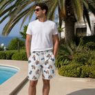 Real-life photo of someone wearing Men's Golden Getaway Custom Face Beach Shorts — custom faces printed all-over