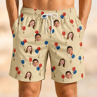 Model wearing Men's Balloon Brigade Custom Face Beach Shorts printed with kids' faces