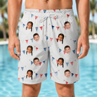 Model wearing Men's Ruby Ruffles Custom Face Beach Shorts printed with kids' faces