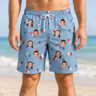 Model wearing Men's Betsy Bounce Custom Face Beach Shorts printed with kids' faces