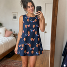 Real-life photo of someone wearing Women's Rebel Reflectors Custom Face Tank Dress — custom faces printed all-over