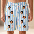 Model wearing Men's Skyburst Salute Custom Face Beach Shorts printed with kids' faces