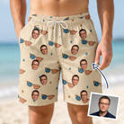 Man wearing Men's Freedom Shades Custom Face Beach Shorts — custom faces printed all-over