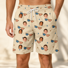 Model wearing Men's Freedom Shades Custom Face Beach Shorts printed with kids' faces