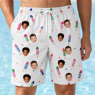 Model wearing Men's Boom Banner Custom Face Beach Shorts printed with kids' faces