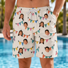 Model wearing Men's Folksy Flutter Custom Face Beach Shorts printed with kids' faces