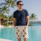 Real-life photo of someone wearing Men's Frank Feast Custom Face Beach Shorts — custom faces printed all-over