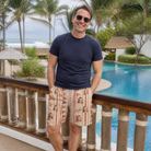 Real-life photo of someone wearing Men's Home Huddle Custom Face Beach Shorts — custom faces printed all-over