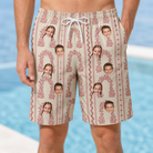 Model wearing Men's Beach Bouquet Custom Face Beach Shorts printed with kids' faces