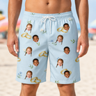 Model wearing Men's Sandbar Signets Custom Face Beach Shorts printed with kids' faces
