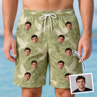 Man wearing Men's Seaglass Serenade Custom Face Beach Shorts — custom faces printed all-over