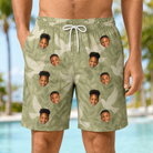 Model wearing Men's Seaglass Serenade Custom Face Beach Shorts printed with kids' faces