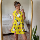 Real-life photo of someone wearing Women's Dovebound Daydream Custom Face V-Neck Dress — custom faces printed all-over