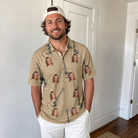 Real-life photo of someone wearing Men's Strum Supreme Custom Face Polo Shirt — custom faces printed all-over