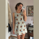Real-life photo of someone wearing Women's Solar Sire Custom Face Tank Dress — custom faces printed all-over
