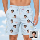 Man wearing Men's Heart Hitch Custom Face Beach Shorts — custom faces printed all-over