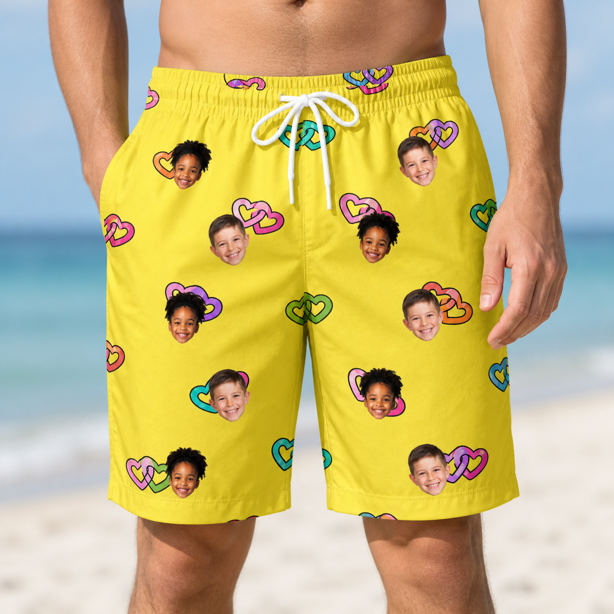 Model wearing Men's Entwined Escapade Custom Face Beach Shorts printed with kids' faces