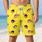 Model wearing Men's Entwined Escapade Custom Face Beach Shorts printed with kids' faces