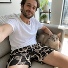 Selfie with the pet whose face is printed all over this Men's Midnight Moonhoot Custom Cat Face Beach Shorts