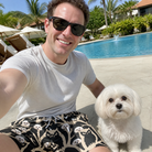 Selfie with the pet whose face is printed all over this Men's Midnight Moonhoot Custom Dog Face Beach Shorts