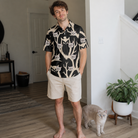 Full-length photo with the pet printed all over this Men's Midnight Moonhoot Custom Cat Face Polo Shirt