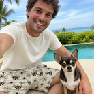 Selfie with the pet whose face is printed all over this Men's Tangle Terror Custom Dog Face Beach Shorts