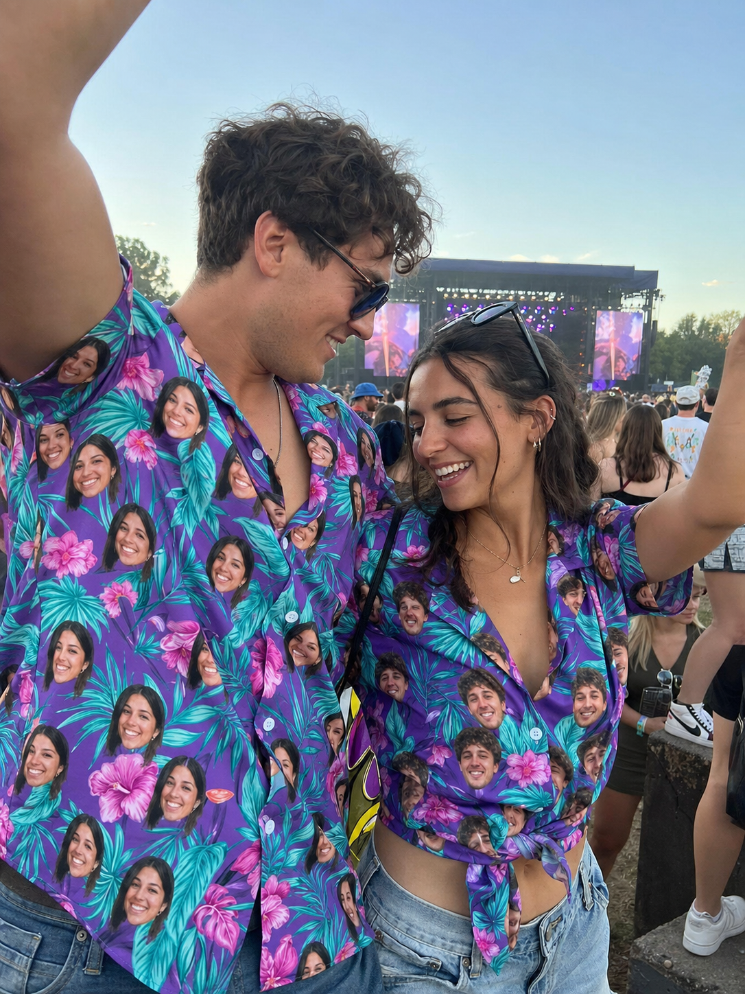 Couple in matching custom face Hawaiian shirts at a festival