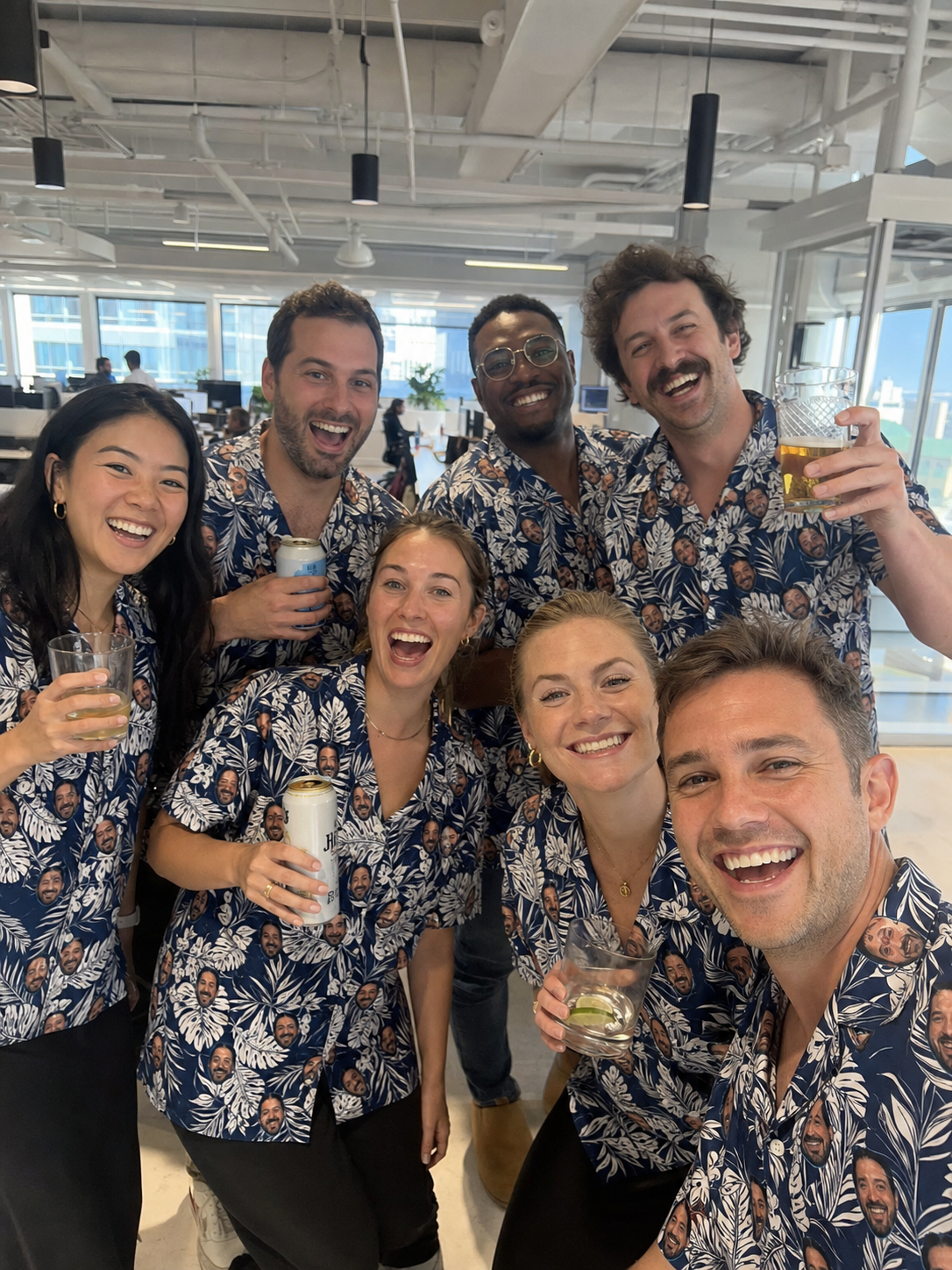 Office team in matching custom face Hawaiian shirts