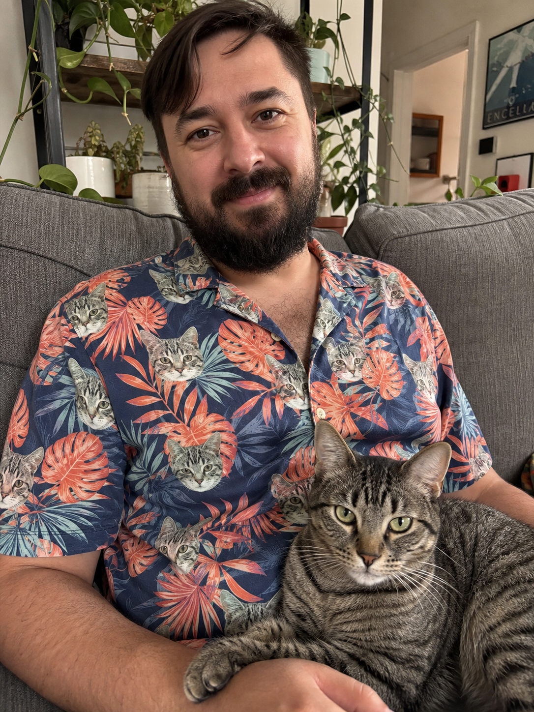Man wearing a Hawaiian shirt printed with his cat